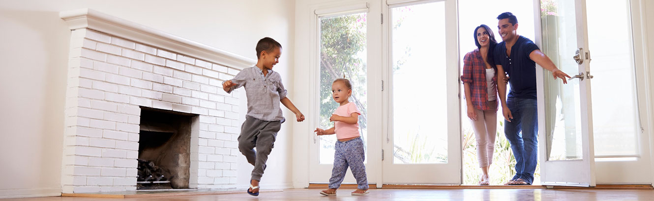 Family entering a new home